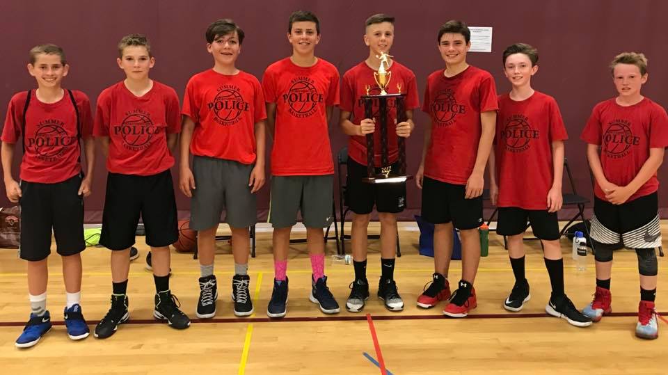 Summer Youth Basketball team with trophy