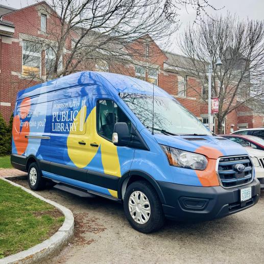 Library Bookmobile, covered in colorful shapes with the library logo and the slogan "where can the library take you?"