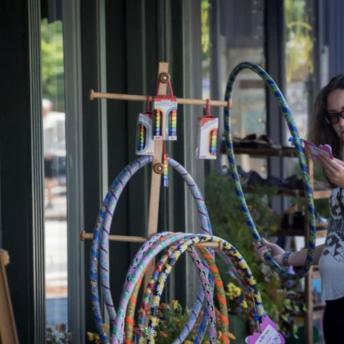 Woman shopping outside of G. Willikers
