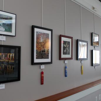 Photos on Levenson front wall including winners