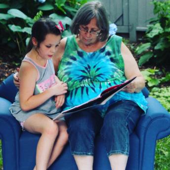 Grandmother and grandaughter in the library's garden