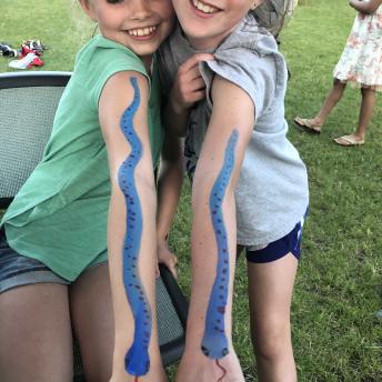 Two tweens show off matching facepaint