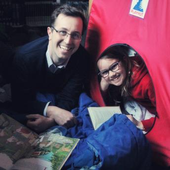 Father and daughter in a tent