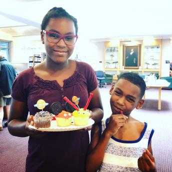 Teen and Brother with Cupcakes