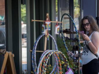 Woman shopping outside of G. Willikers