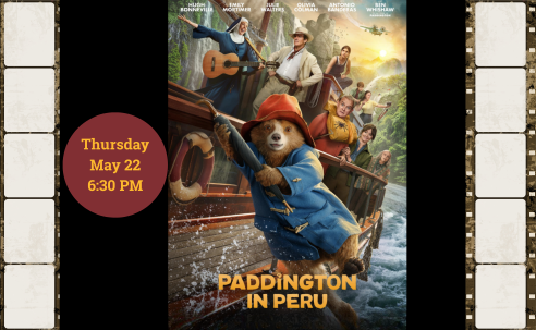 Paddington Bear hangs off the side of a boat with people on the boat in the background Paddington in Peru Thursday May 22 at 6:30 PM