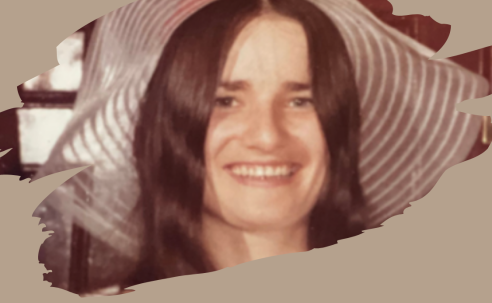 Woman with long dark hair in a big floppy summer hat smiling at the camera. The Murder of Dorothy Milliken. True Crime Book Talk. Sharon Kitchens