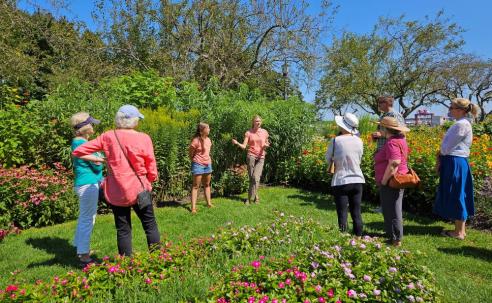 Parks & Greenery Department interns lead a garden tour in Prescott Park in 2024.